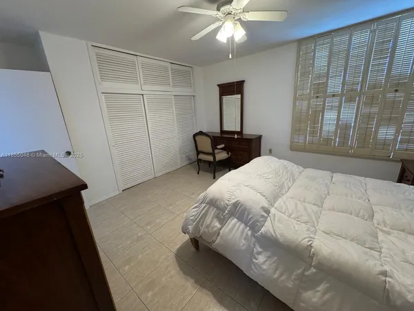 a view of a dining room with furniture and window