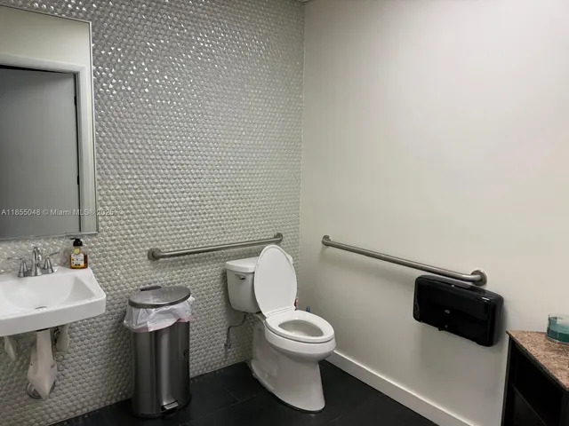 a view of roof deck with wooden floor and city view