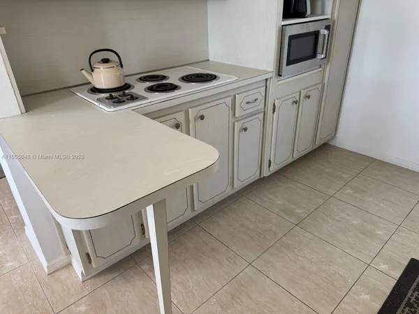 a view of kitchen with livingroom