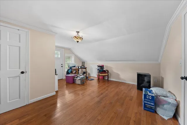 a view of a livingroom with furniture and hardwood floor