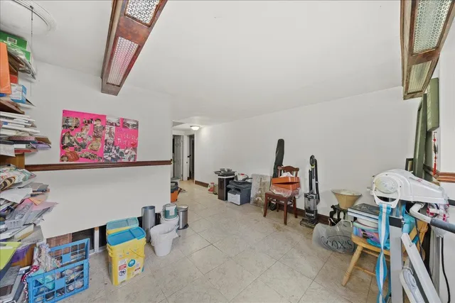 a living room with lots of furniture and gym equipment