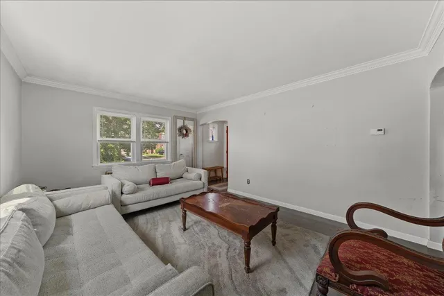 a living room with furniture and a window