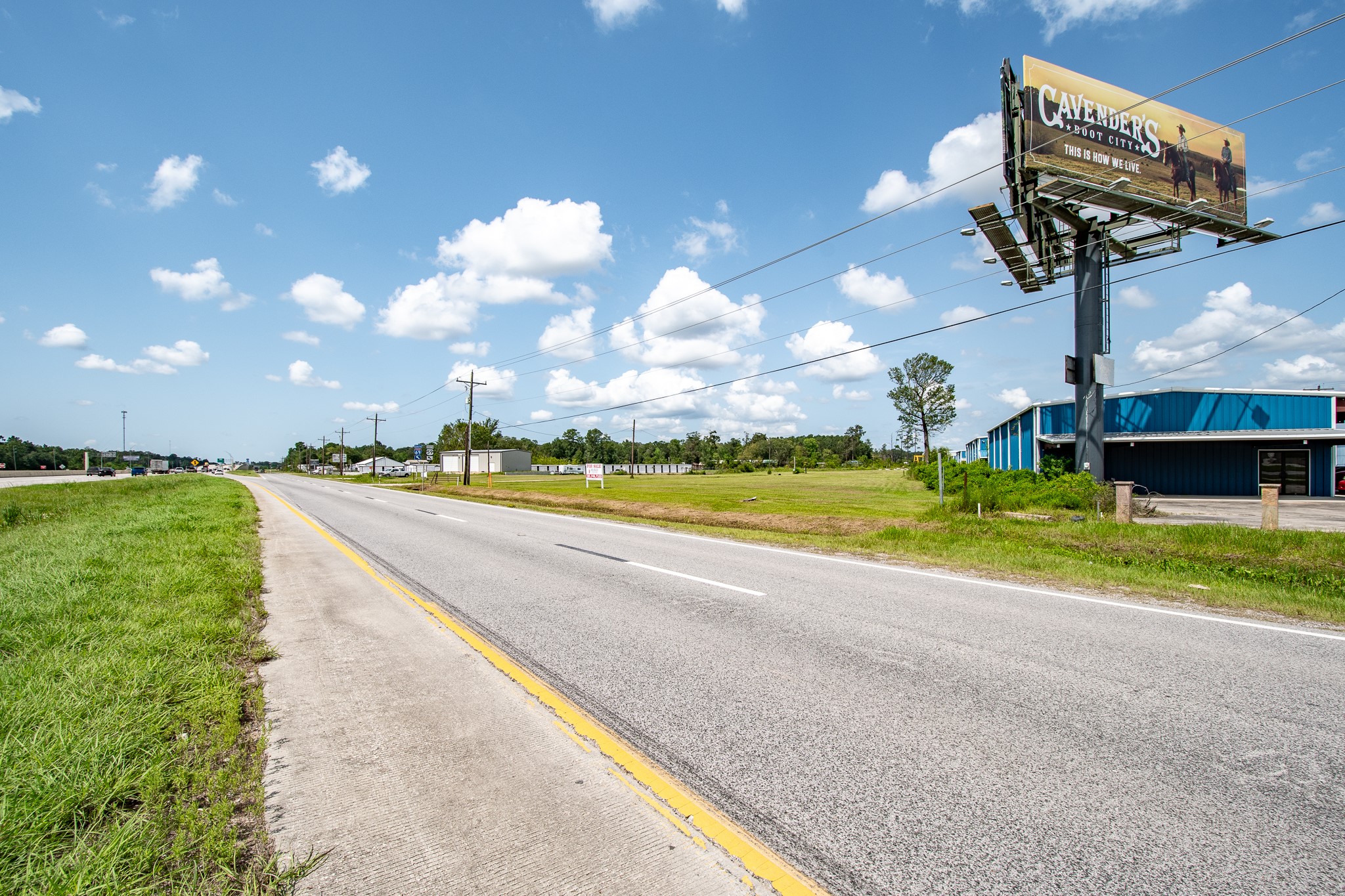 12794 Highway 59 Splendora, TX 77372 - Photo 12 of 12 a view of a swimming pool and a yard