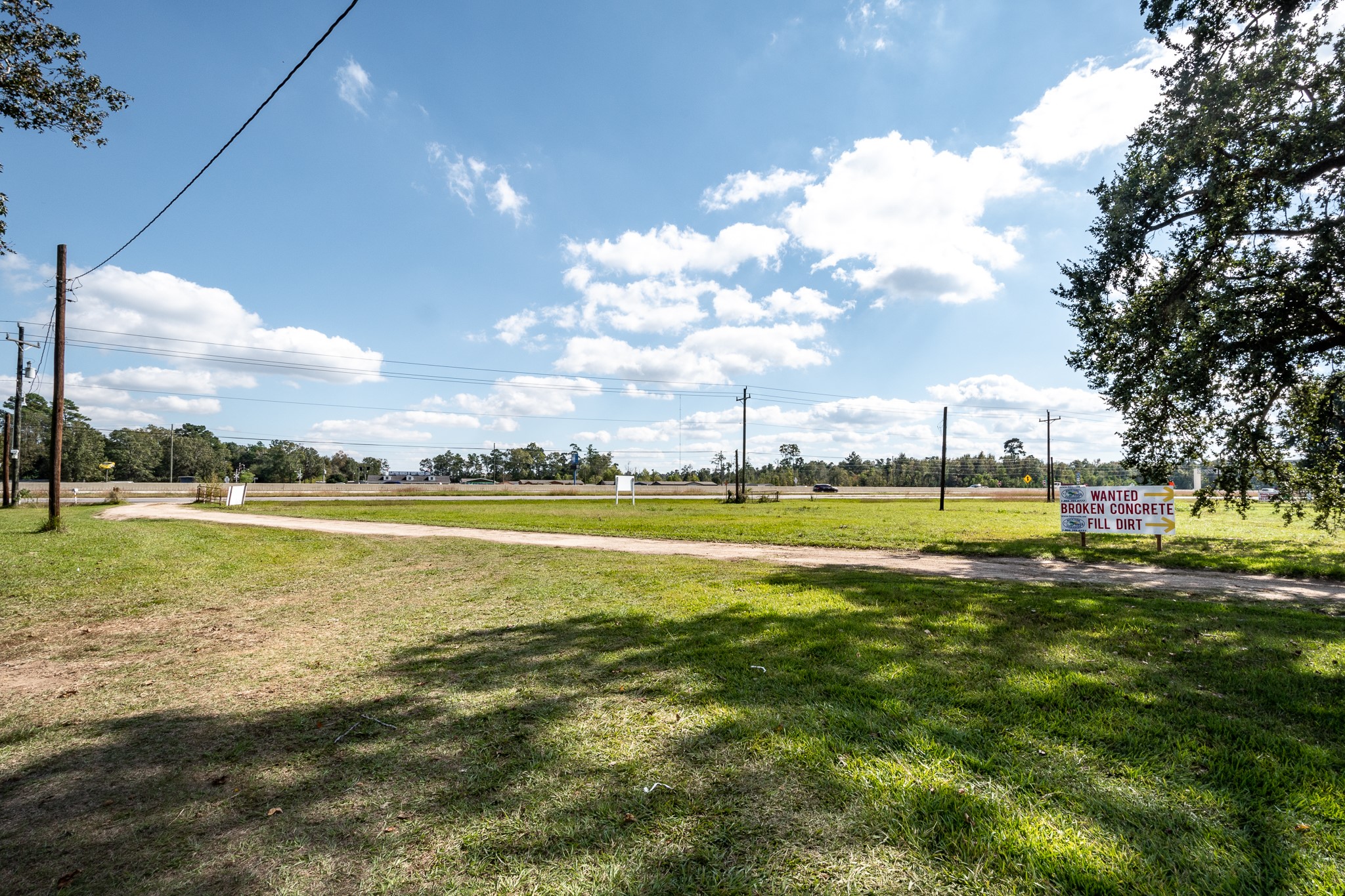 12794 Highway 59 Splendora, TX 77372 - Photo 9 of 12 a view of a lake and houses in the back