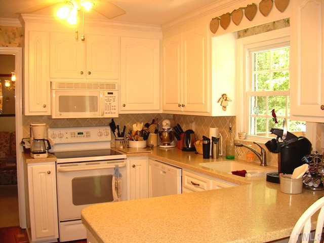 1013 Donphil Road Durham, NC 27712 - Photo 7 of 19 updated kitchen with ss countertops, custom cabinets.