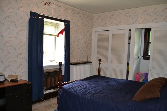 724 North Spring Street Elgin, IL 60120 - Photo 14 of 19 a bedroom with a bed and a window