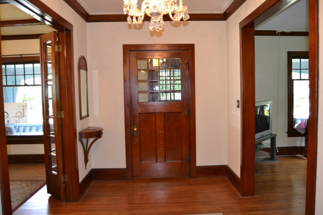 724 North Spring Street Elgin, IL 60120 - Photo 4 of 19 a view of a livingroom with wooden floor and windows