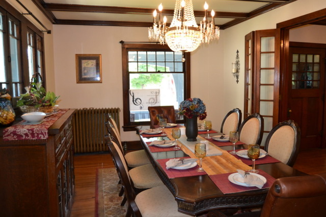 724 North Spring Street Elgin, IL 60120 - Photo 9 of 19 a view of a dining room with furniture a chandelier and large windows