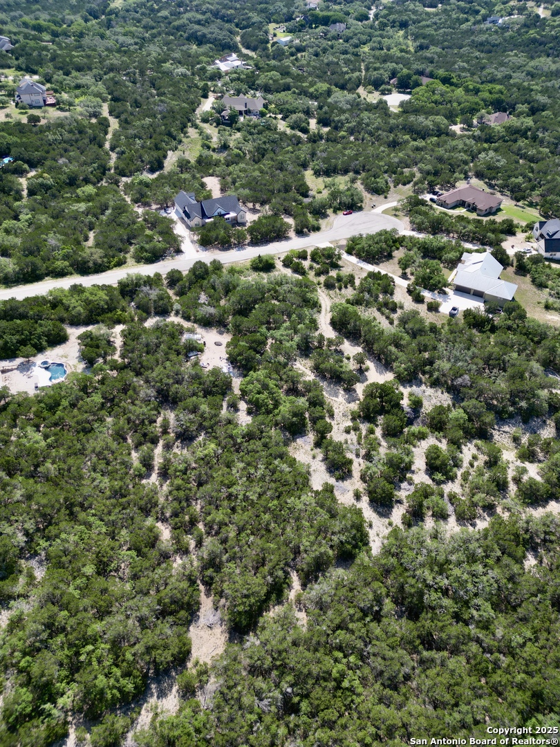 1730 Private Road Mico, TX 78056 - Photo 3 of 7 an aerial view of residential houses with outdoor space and trees