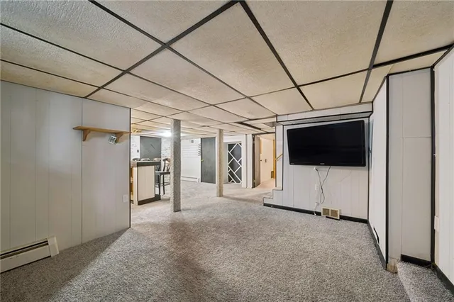 a view of hallway with stairs and a couch