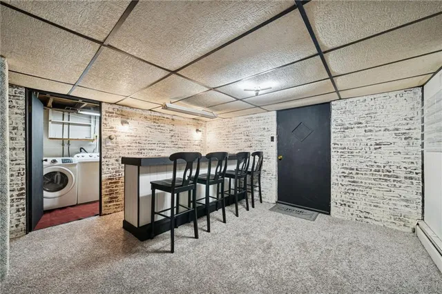a view of a hallway to closet and livingroom