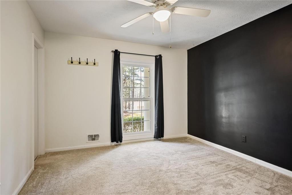 4505 Cochran Mill Road Fairburn, GA 30213 - Photo 20 of 36 a view of an empty room with a window