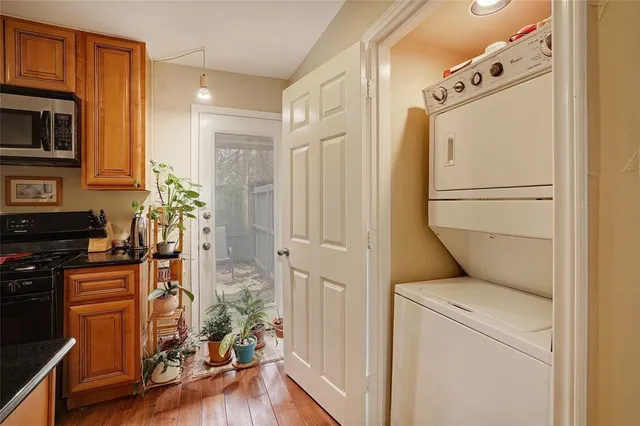 a kitchen with stainless steel appliances a refrigerator a stove a microwave and cabinets