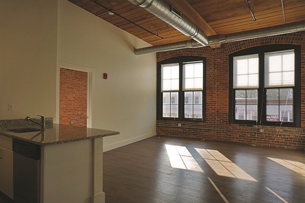 60 Water Street, Unit 2006 North Andover, MA 01845 - Photo 3 of 17 a view of empty room with wooden floor and fan