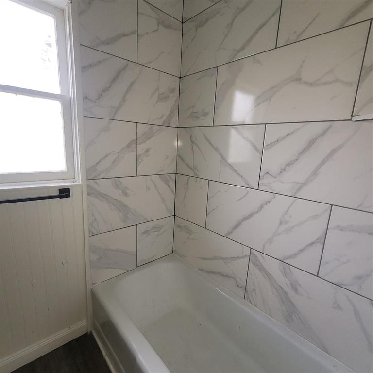 410 Southwest 3rd Street Kerens, TX 75144 - Photo 16 of 21 a bathroom with a shower