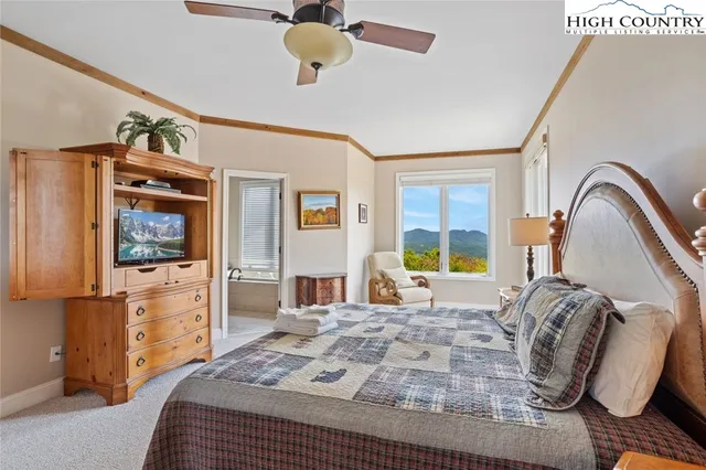 a bathroom with a sink a toilet and shower curtain