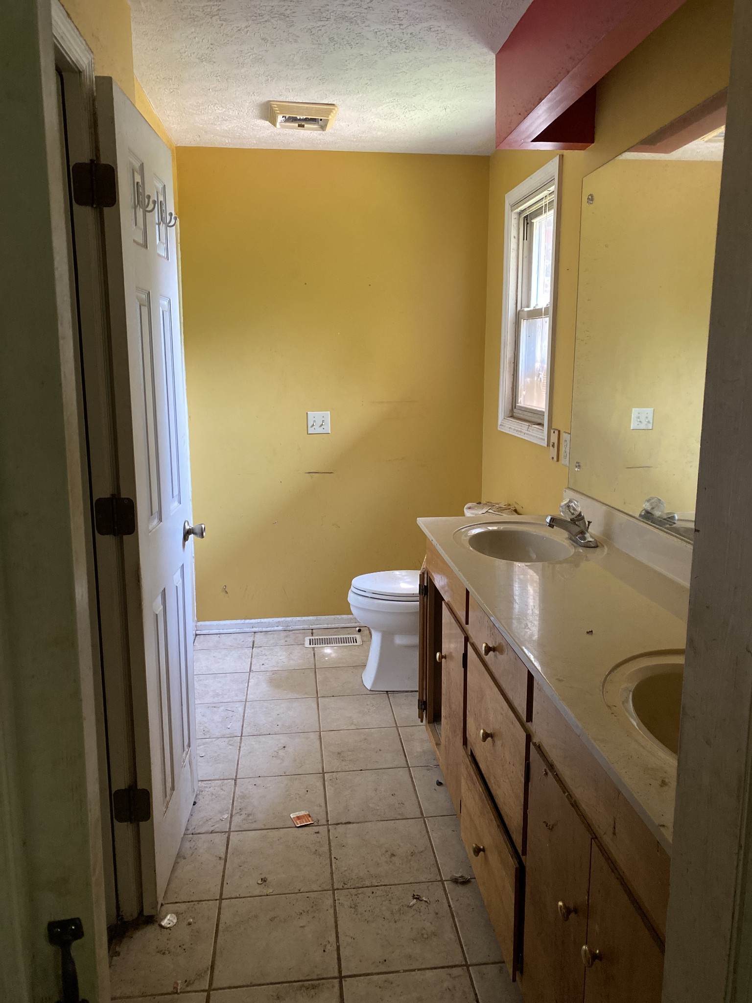 831 Old Shannon Road Lebanon, TN 37090 - Photo 4 of 11 a bathroom with a granite countertop sink a toilet a mirror and shower