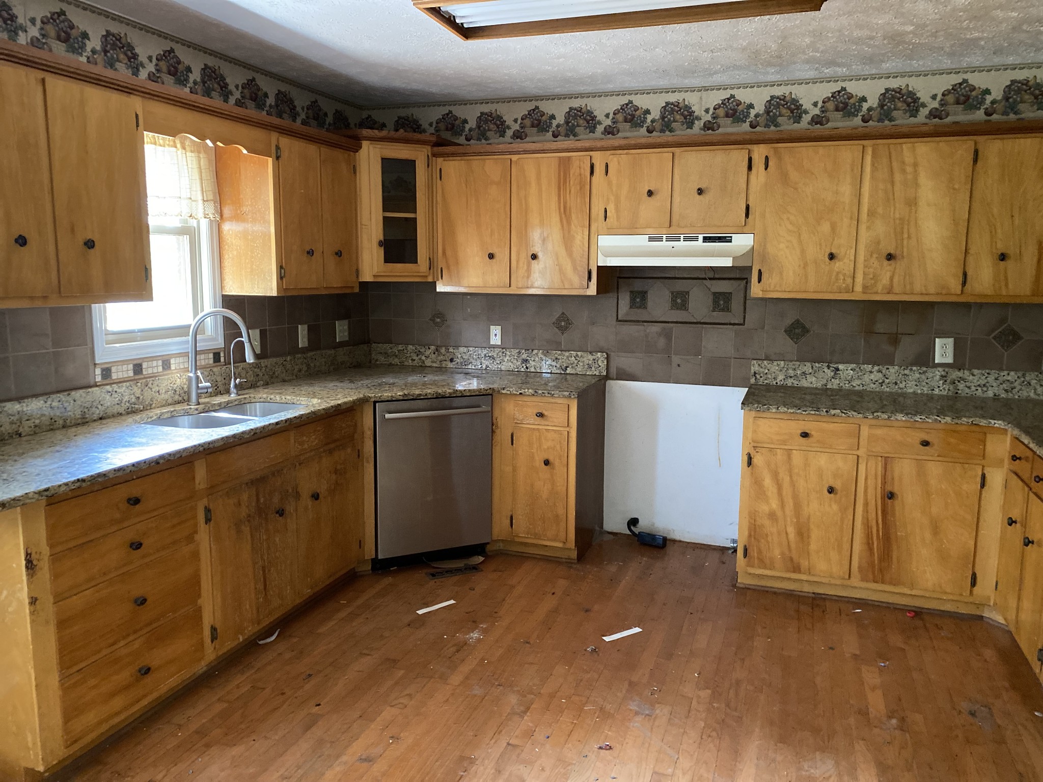 831 Old Shannon Road Lebanon, TN 37090 - Photo 6 of 11 a kitchen with granite countertop a sink stainless steel appliances and cabinets