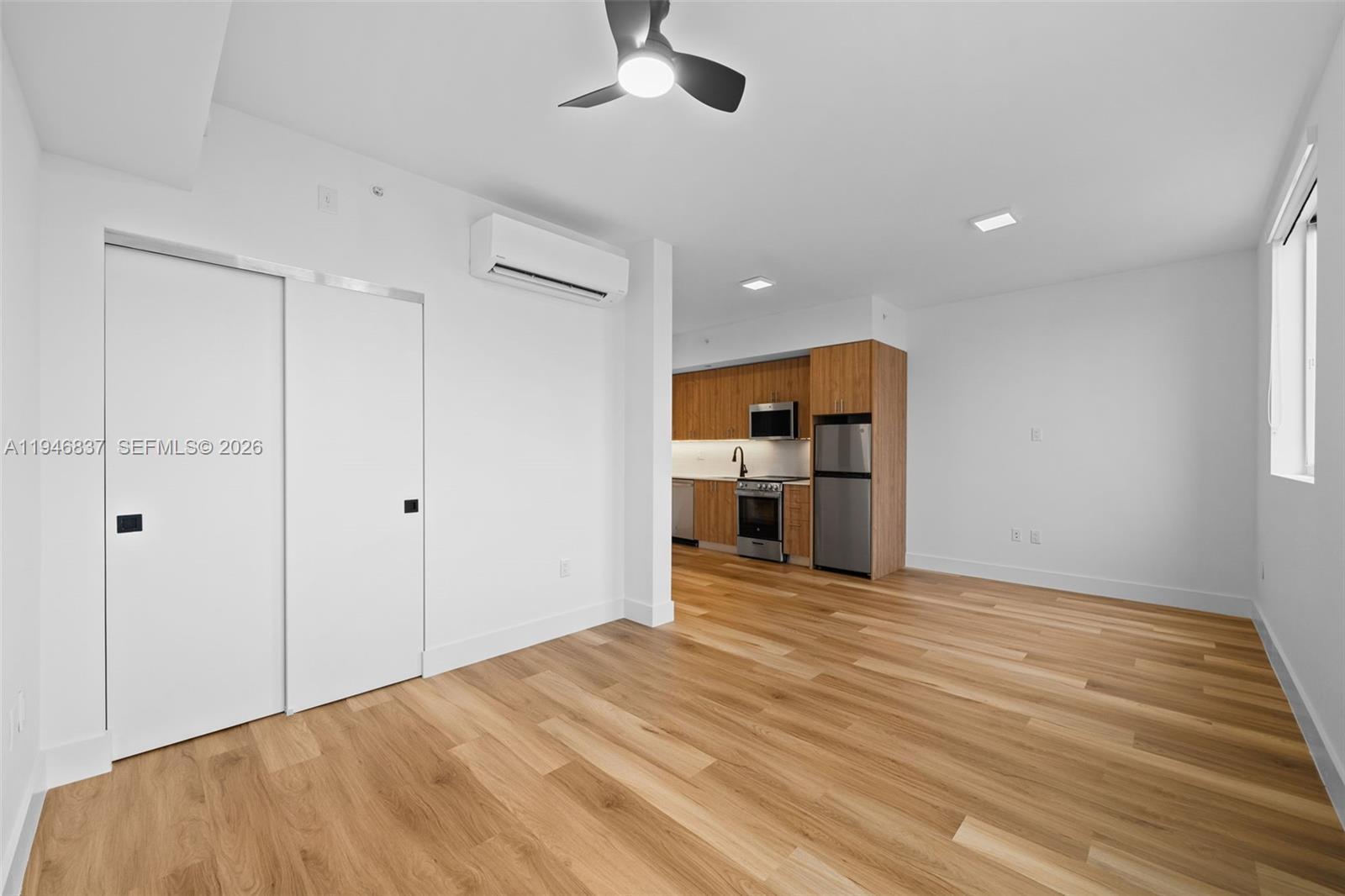 650 Southwest 1st Street, Unit 303 Miami, FL 33130 - Photo 7 of 11 a view of a kitchen with a sink and a cabinet an empty room