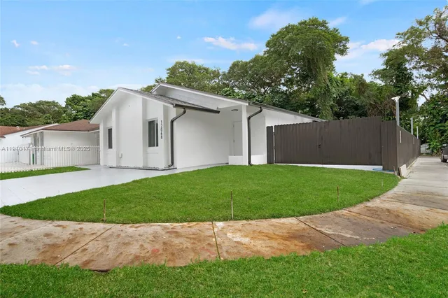a view of backyard of house with garage