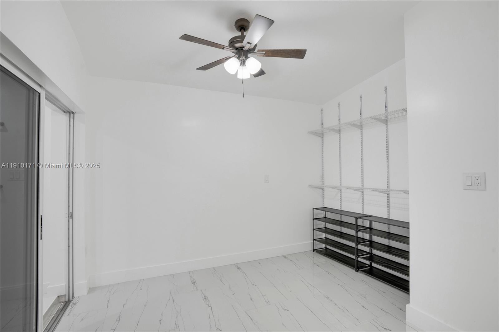 12068 Southwest 210th Street Miami, FL 33177 - Photo 12 of 19 a view of room with a ceiling fan