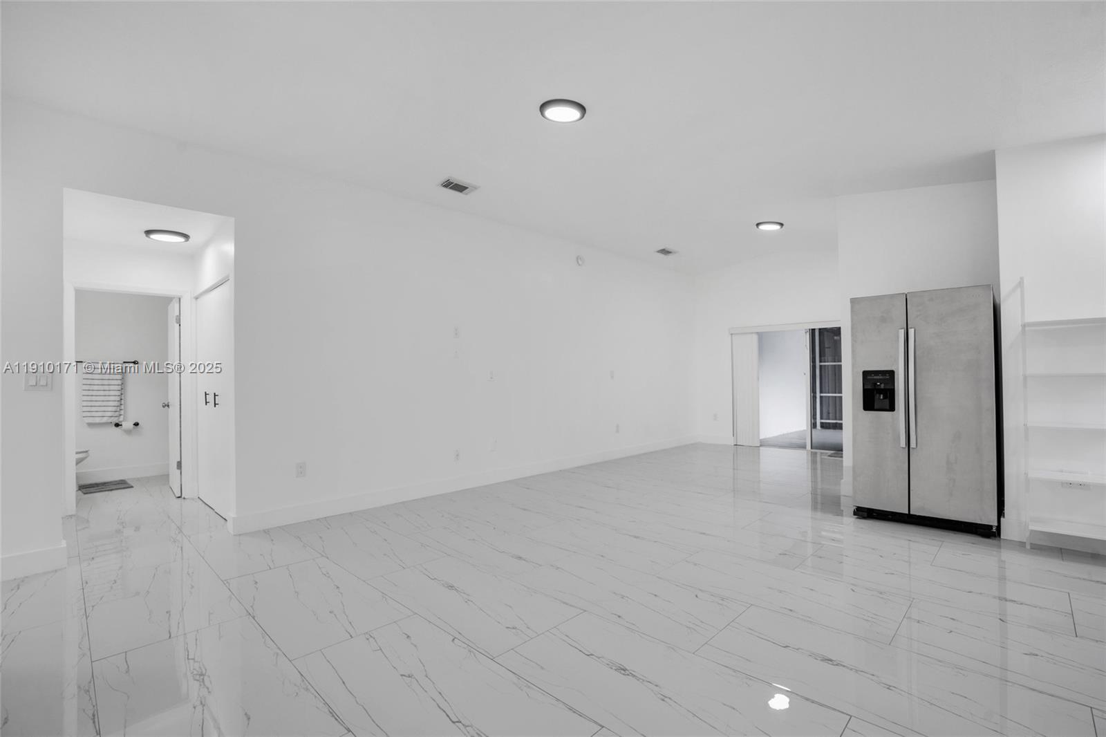 12068 Southwest 210th Street Miami, FL 33177 - Photo 6 of 19 a view of a kitchen with a refrigerator and a sink