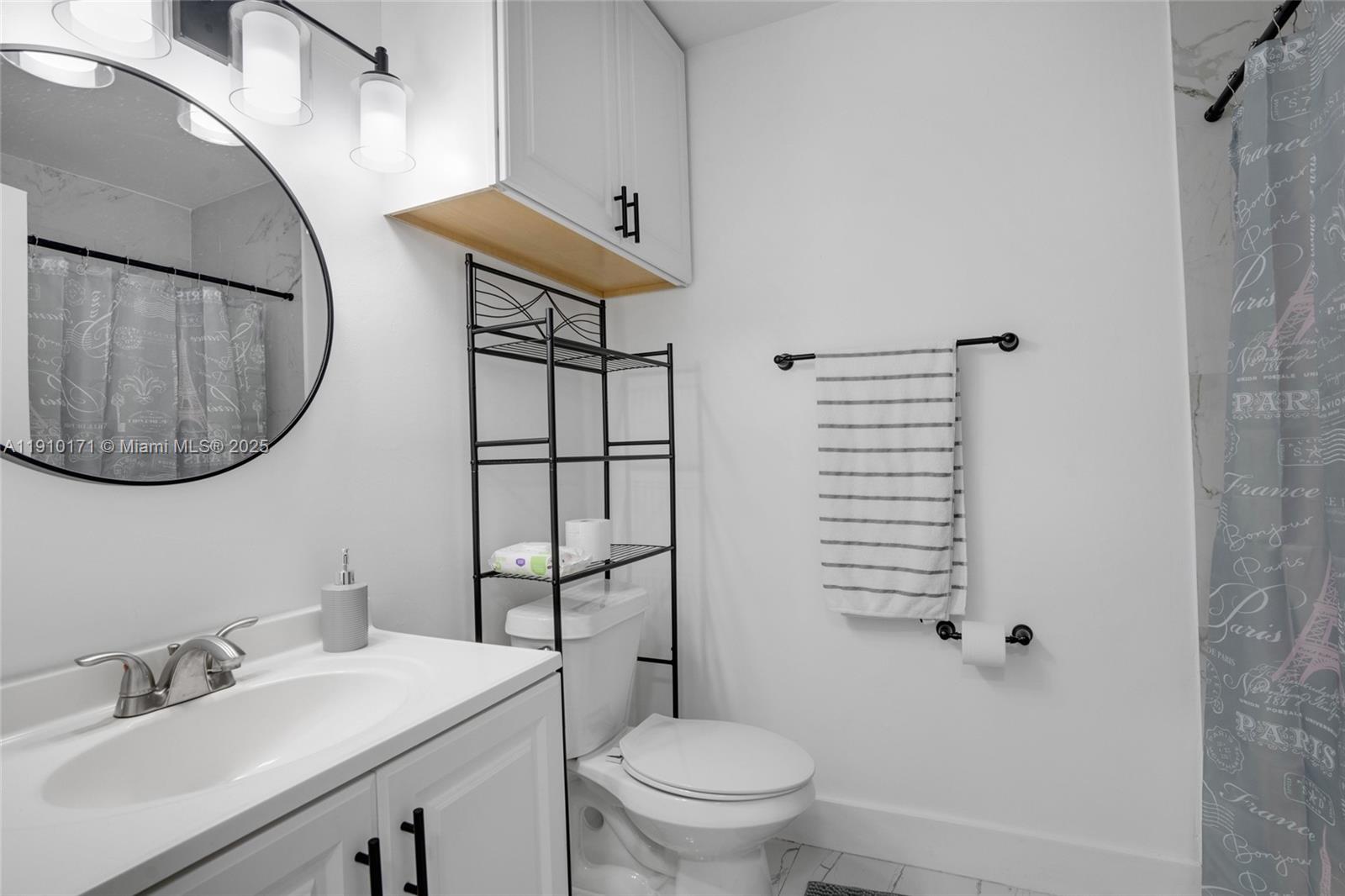 12068 Southwest 210th Street Miami, FL 33177 - Photo 8 of 19 a bathroom with a sink a toilet and shower