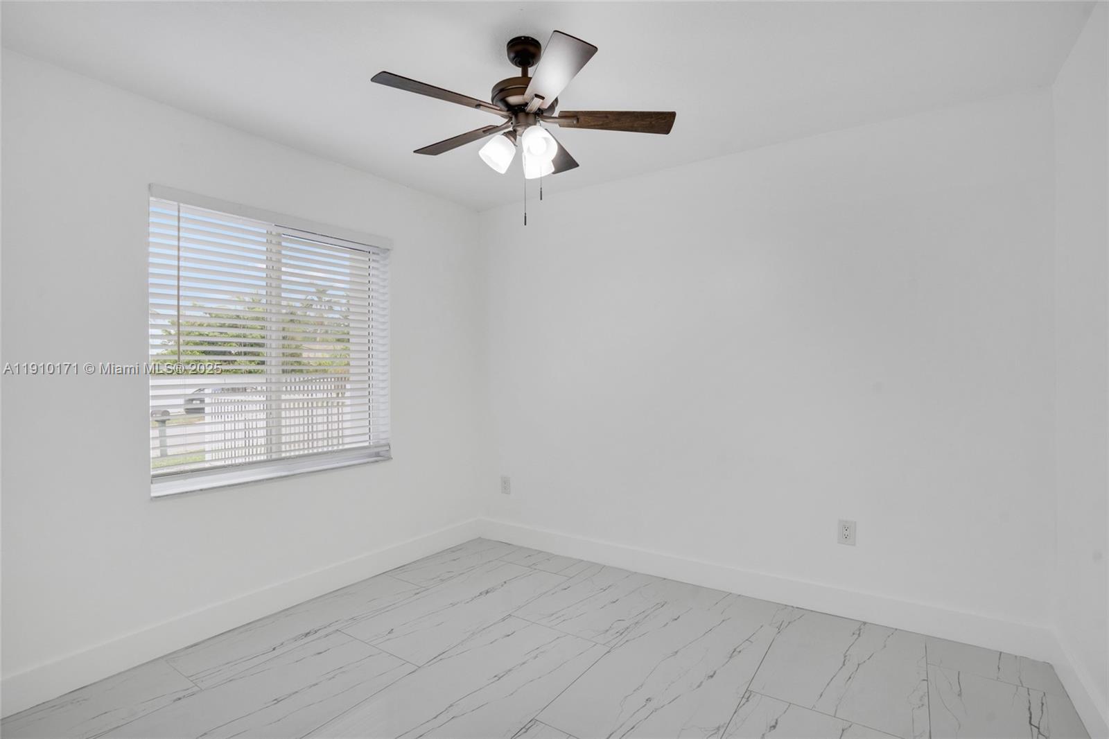 12068 Southwest 210th Street Miami, FL 33177 - Photo 10 of 19 an empty room with a window