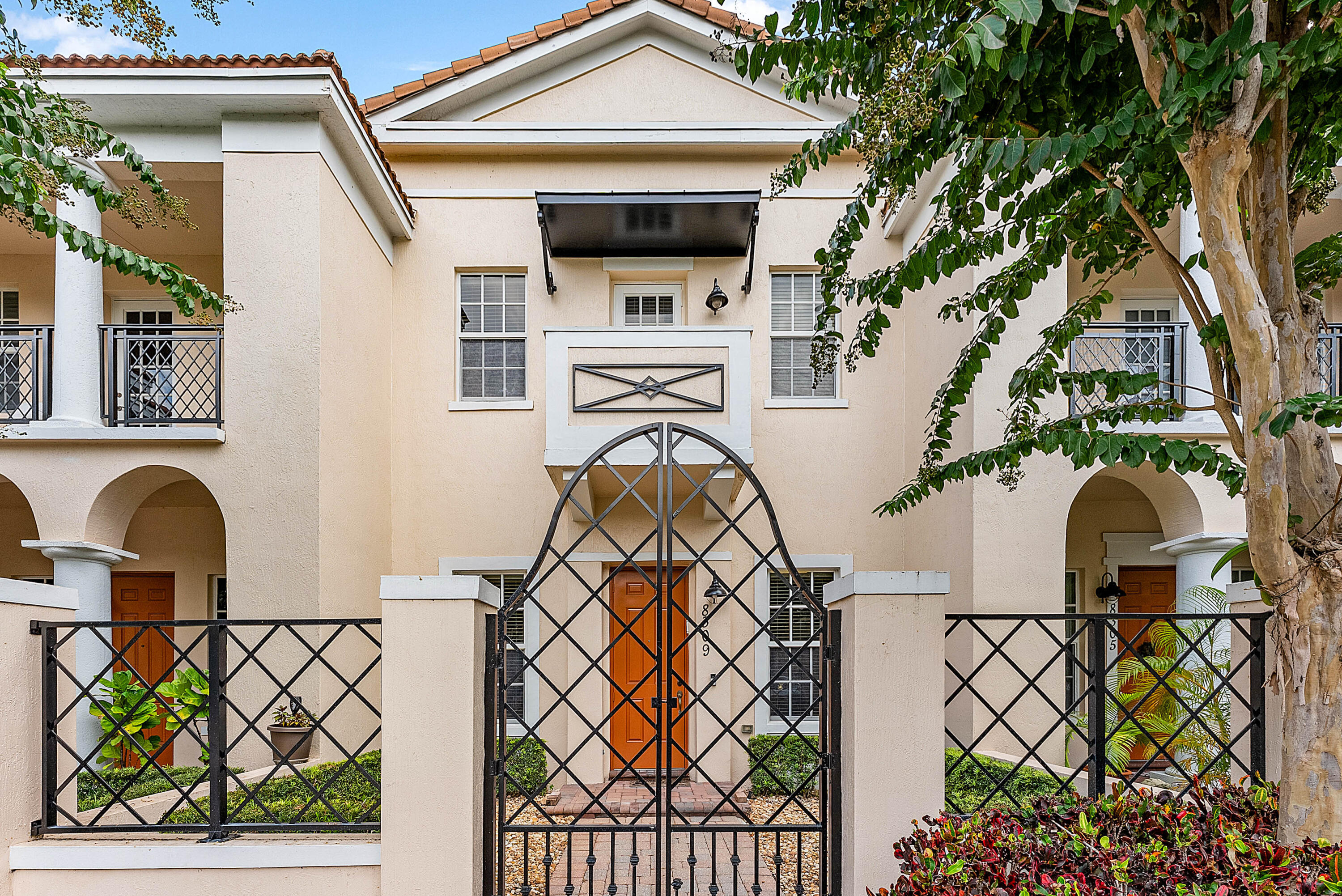 a front view of a house with garden