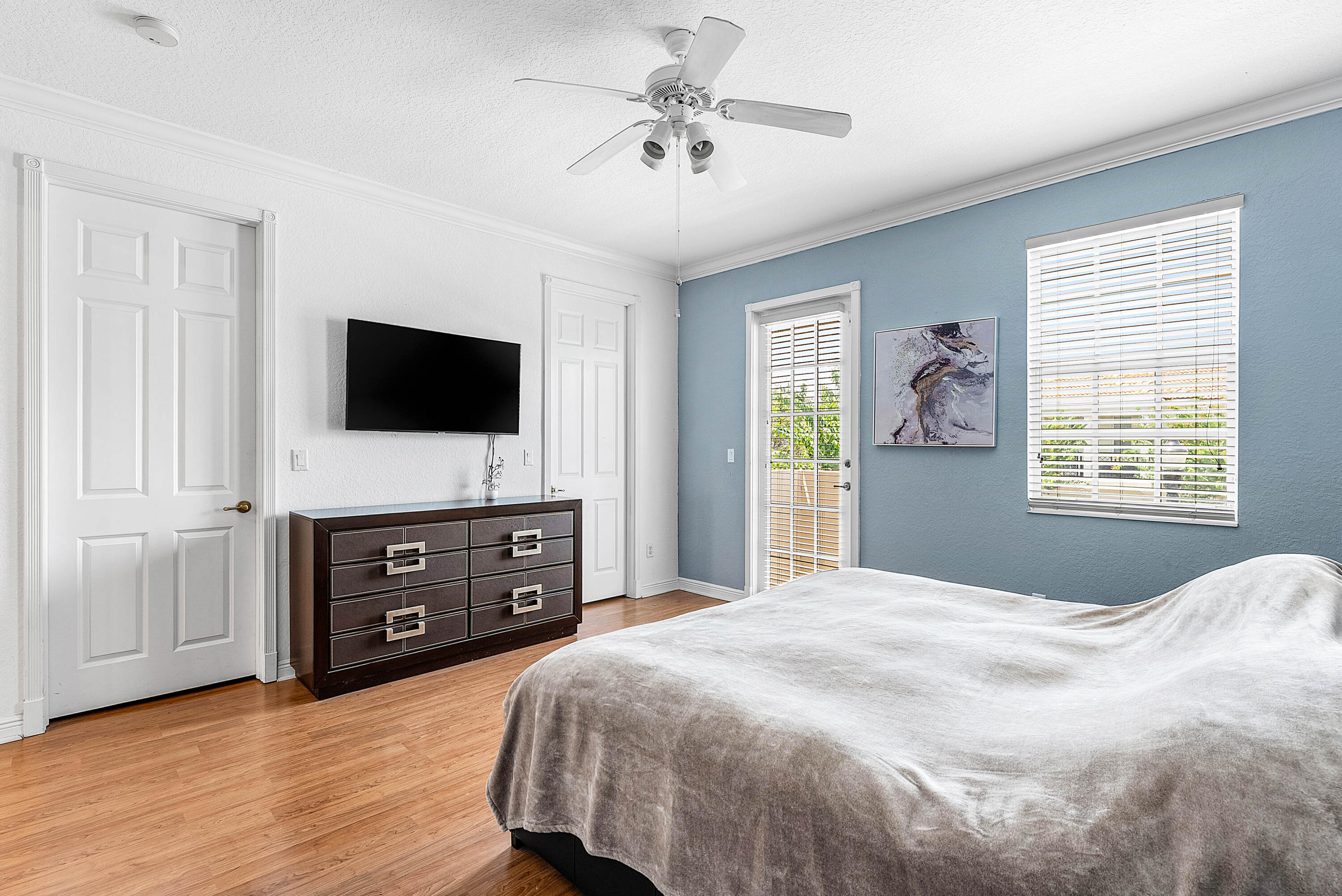 8309 Northwest 8th Way Boca Raton, FL 33487 - Photo 16 of 39 a bedroom with a bed and a flat screen tv