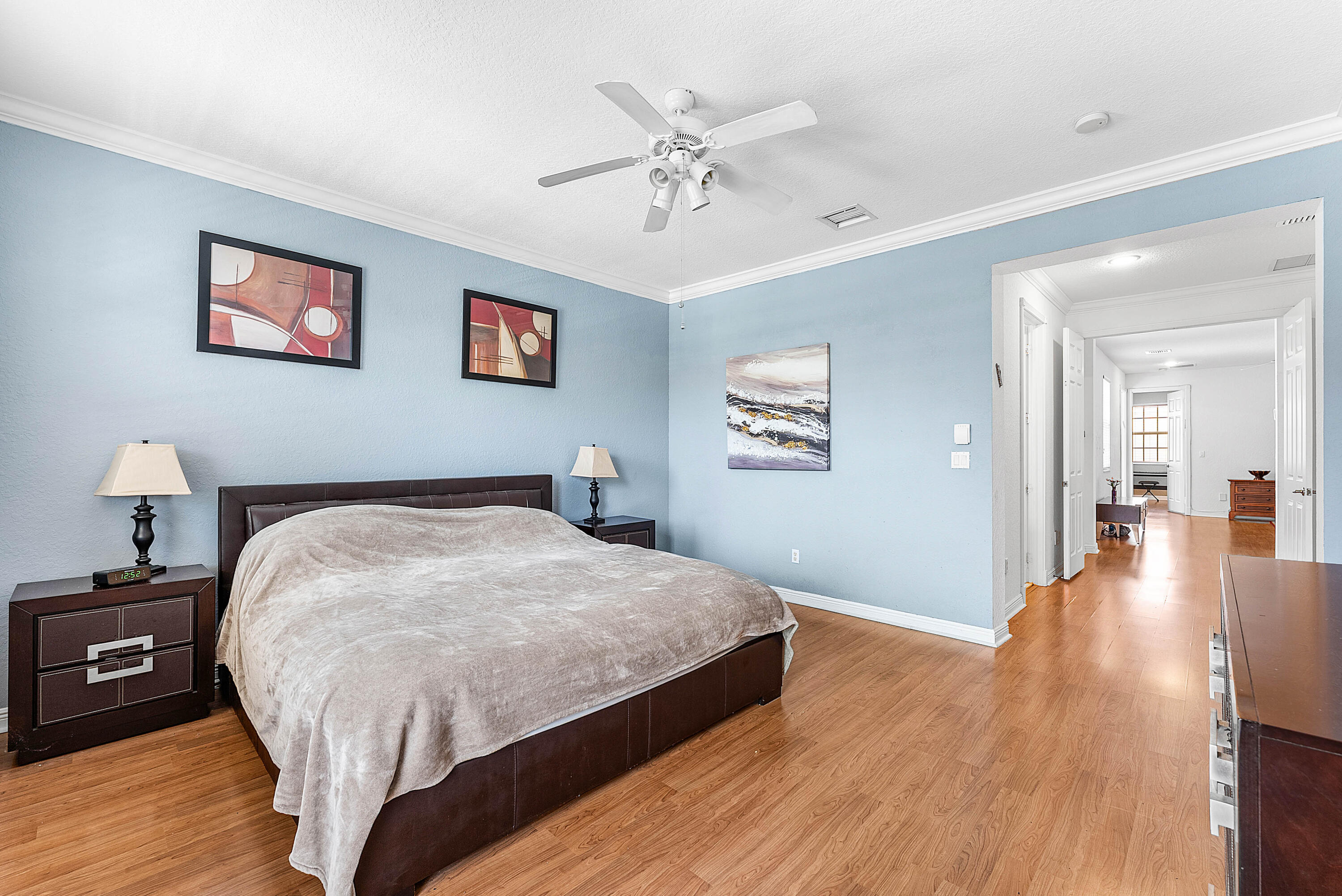 8309 Northwest 8th Way Boca Raton, FL 33487 - Photo 17 of 39 a bed room with a bed and a chandelier