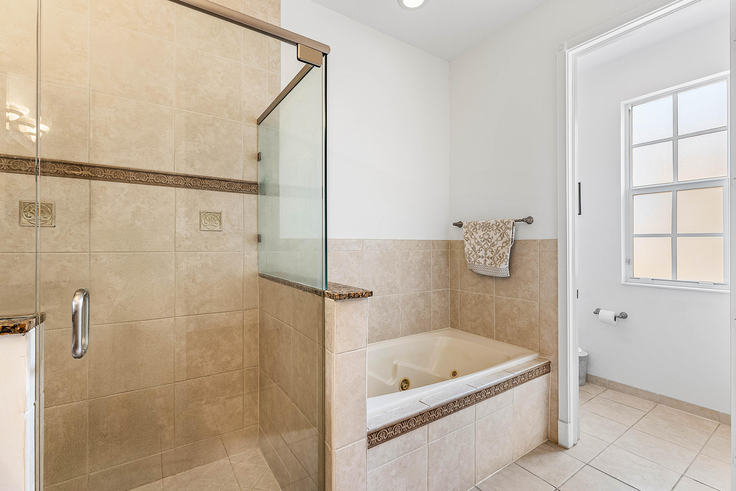 8309 Northwest 8th Way Boca Raton, FL 33487 - Photo 19 of 39 a bath room with a bath tub and a shower