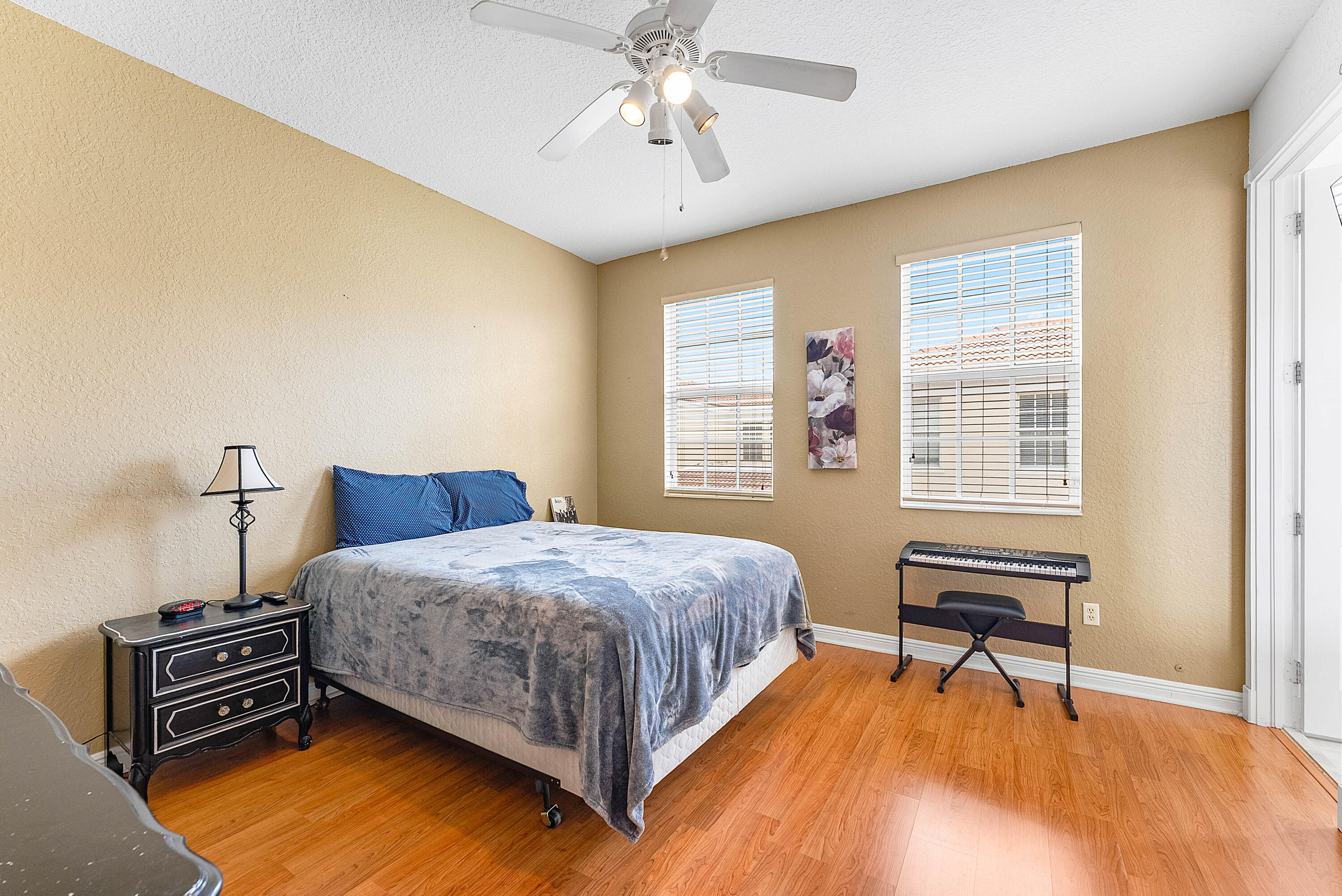 8309 Northwest 8th Way Boca Raton, FL 33487 - Photo 20 of 39 a bedroom with a bed and a dresser next to a window