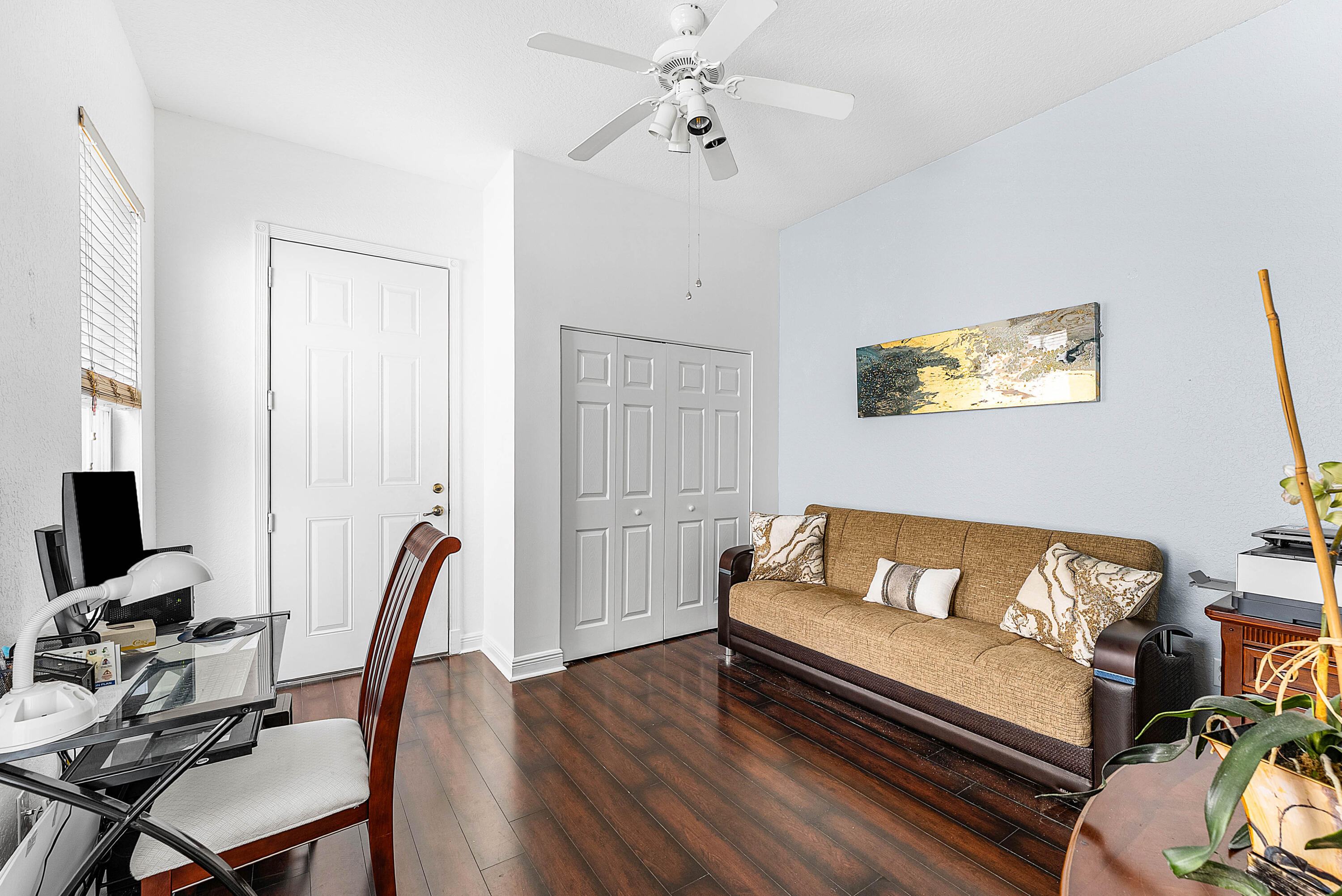 8309 Northwest 8th Way Boca Raton, FL 33487 - Photo 22 of 39 a living room with furniture a flat screen tv and a window
