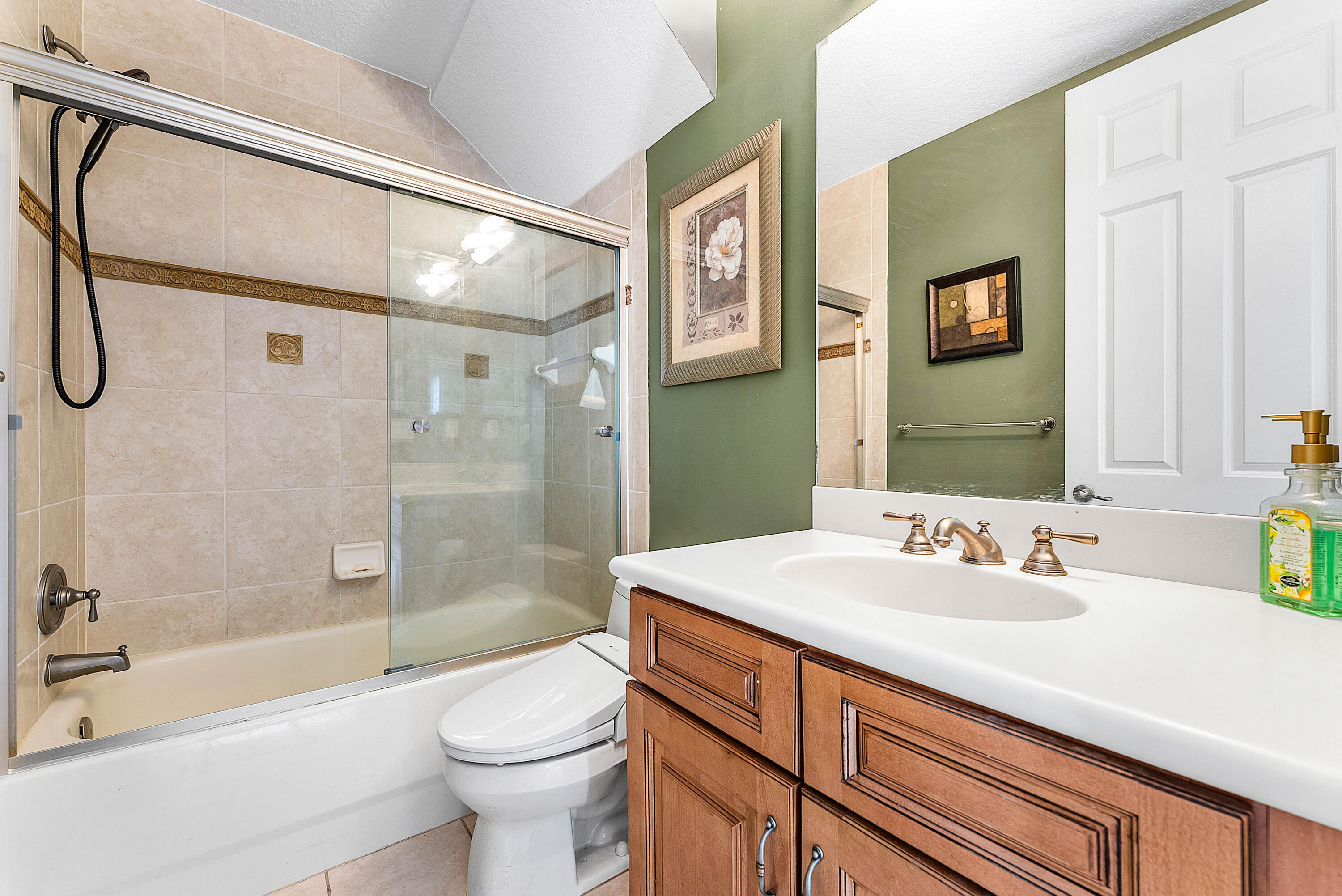 8309 Northwest 8th Way Boca Raton, FL 33487 - Photo 24 of 39 a bathroom with a sink a toilet and shower