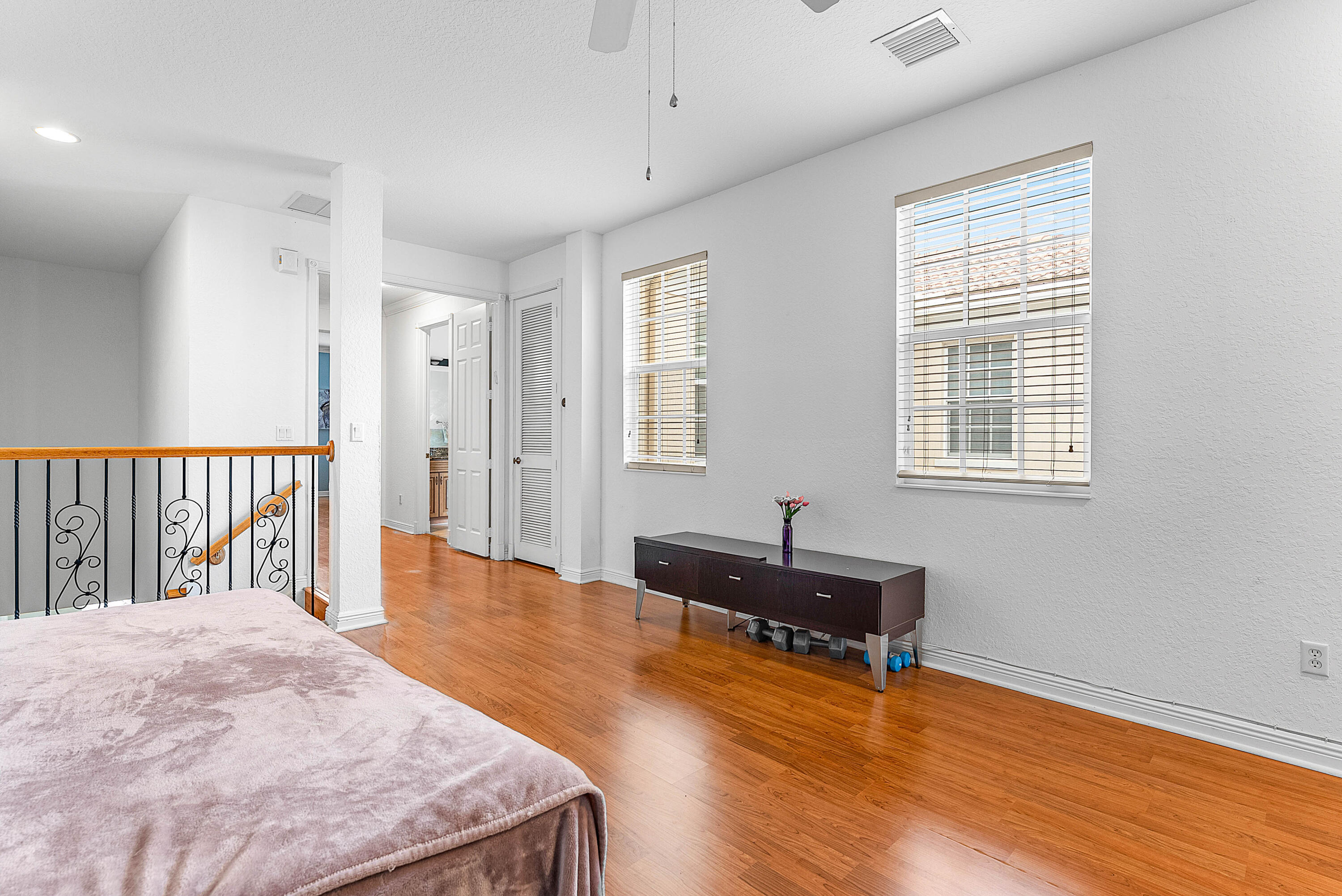 8309 Northwest 8th Way Boca Raton, FL 33487 - Photo 26 of 39 a spacious bedroom with a bed and a window