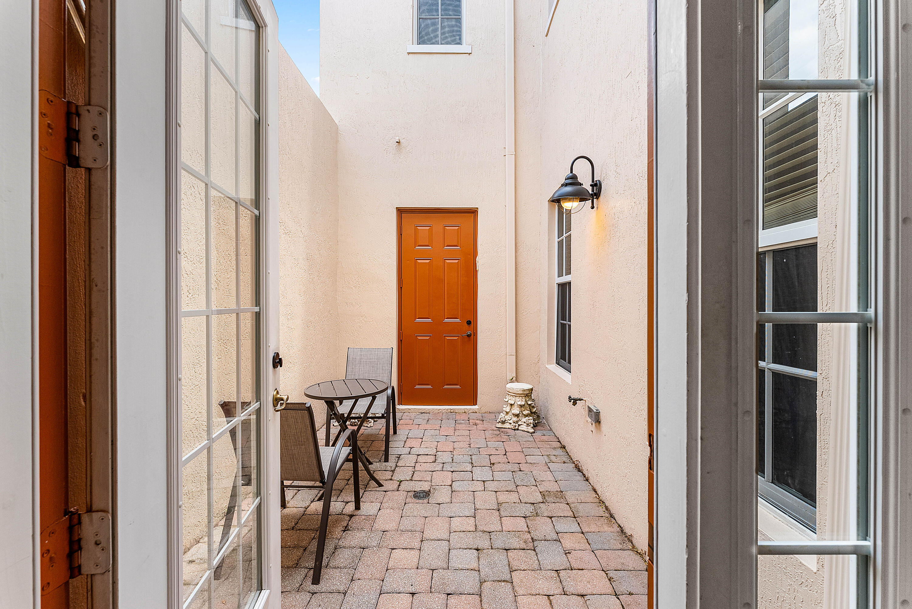 8309 Northwest 8th Way Boca Raton, FL 33487 - Photo 29 of 39 a view of a hallway with windows
