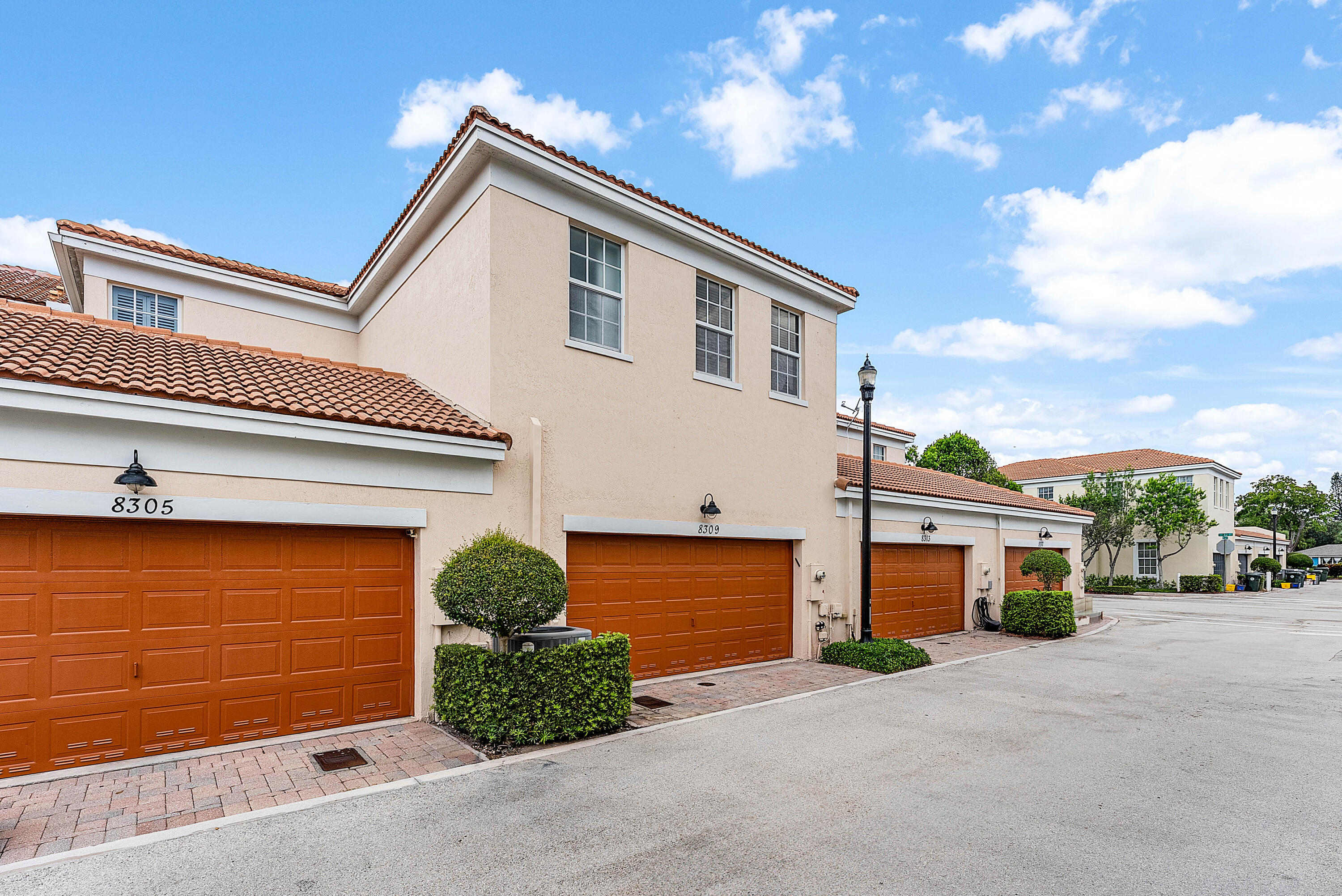 8309 Northwest 8th Way Boca Raton, FL 33487 - Photo 30 of 39 a front view of a house with a yard and garage