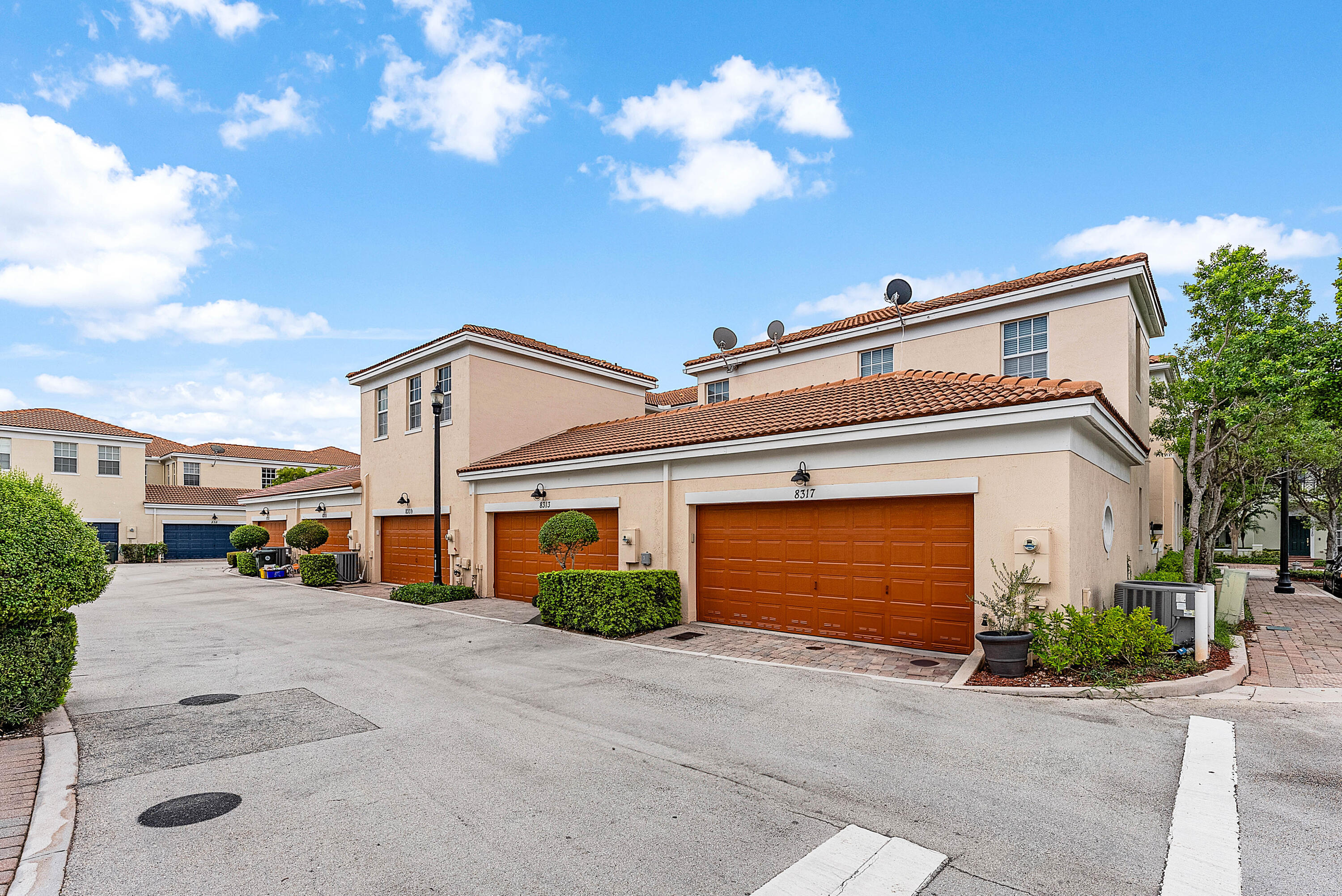 8309 Northwest 8th Way Boca Raton, FL 33487 - Photo 31 of 39 a front view of a house with a yard and garage