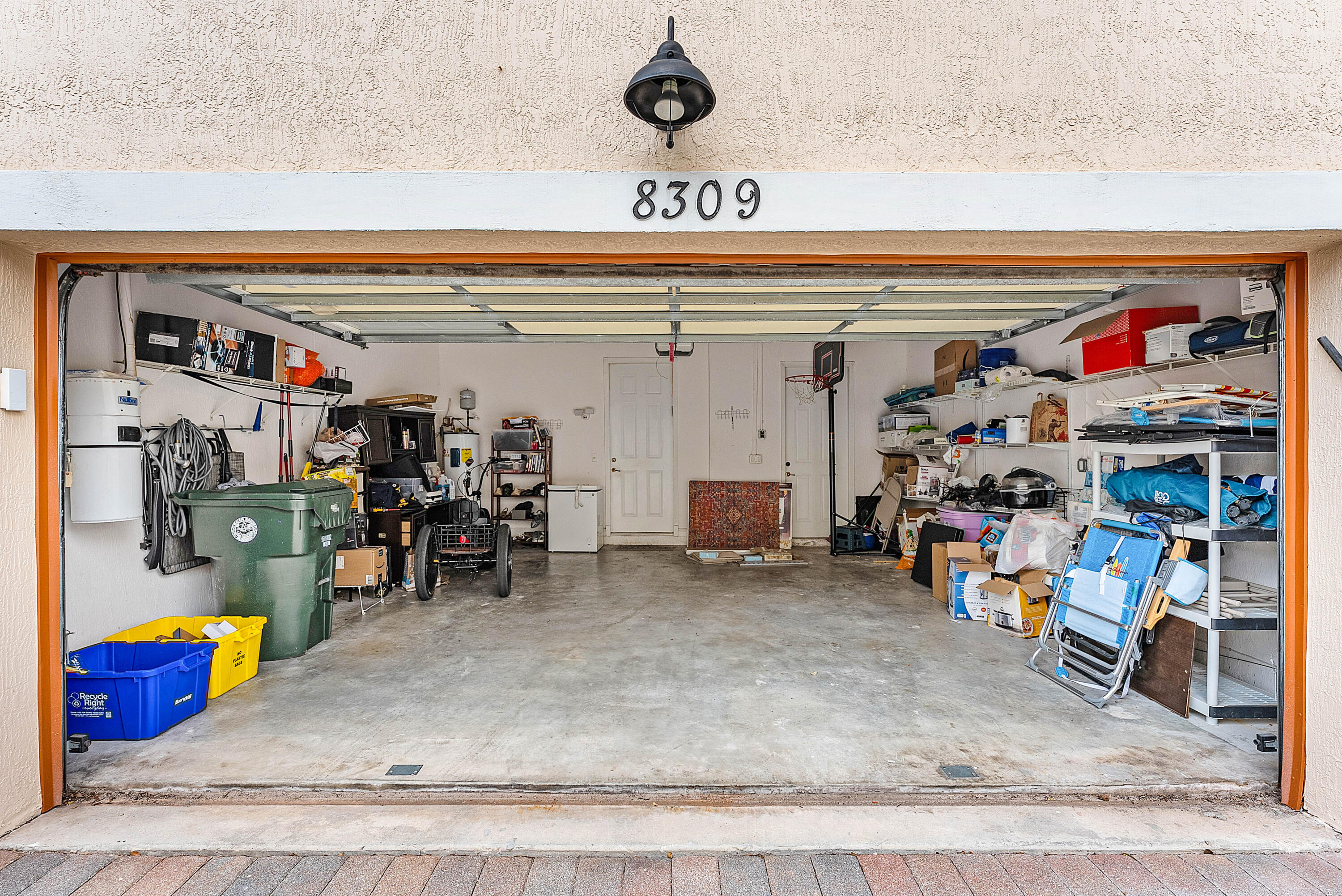 8309 Northwest 8th Way Boca Raton, FL 33487 - Photo 32 of 39 a view of a storage room with a lot of stuff