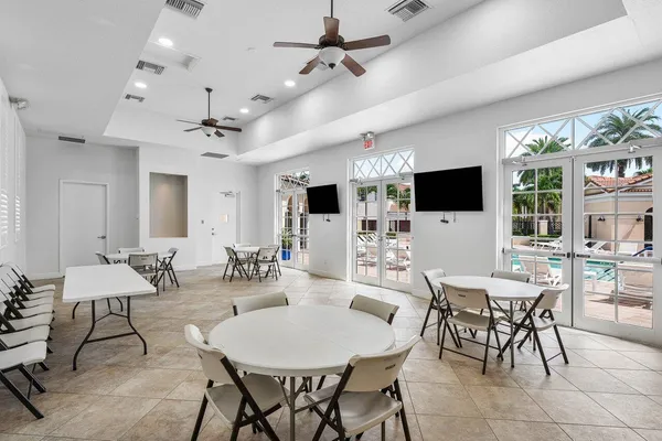 a view of a dining room with furniture wooden floor and chandelier