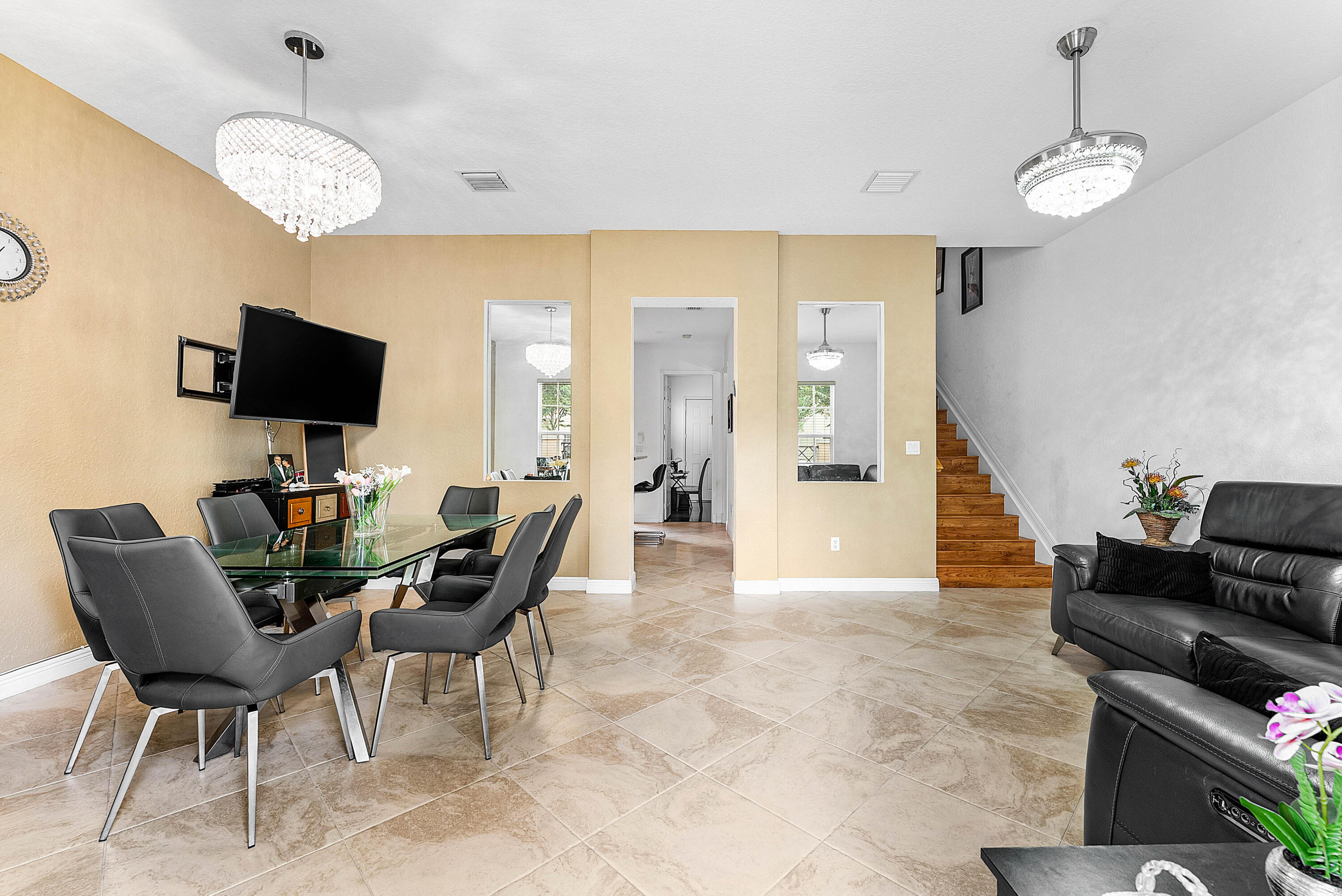 8309 Northwest 8th Way Boca Raton, FL 33487 - Photo 7 of 39 a view of a livingroom with furniture and a flat screen tv