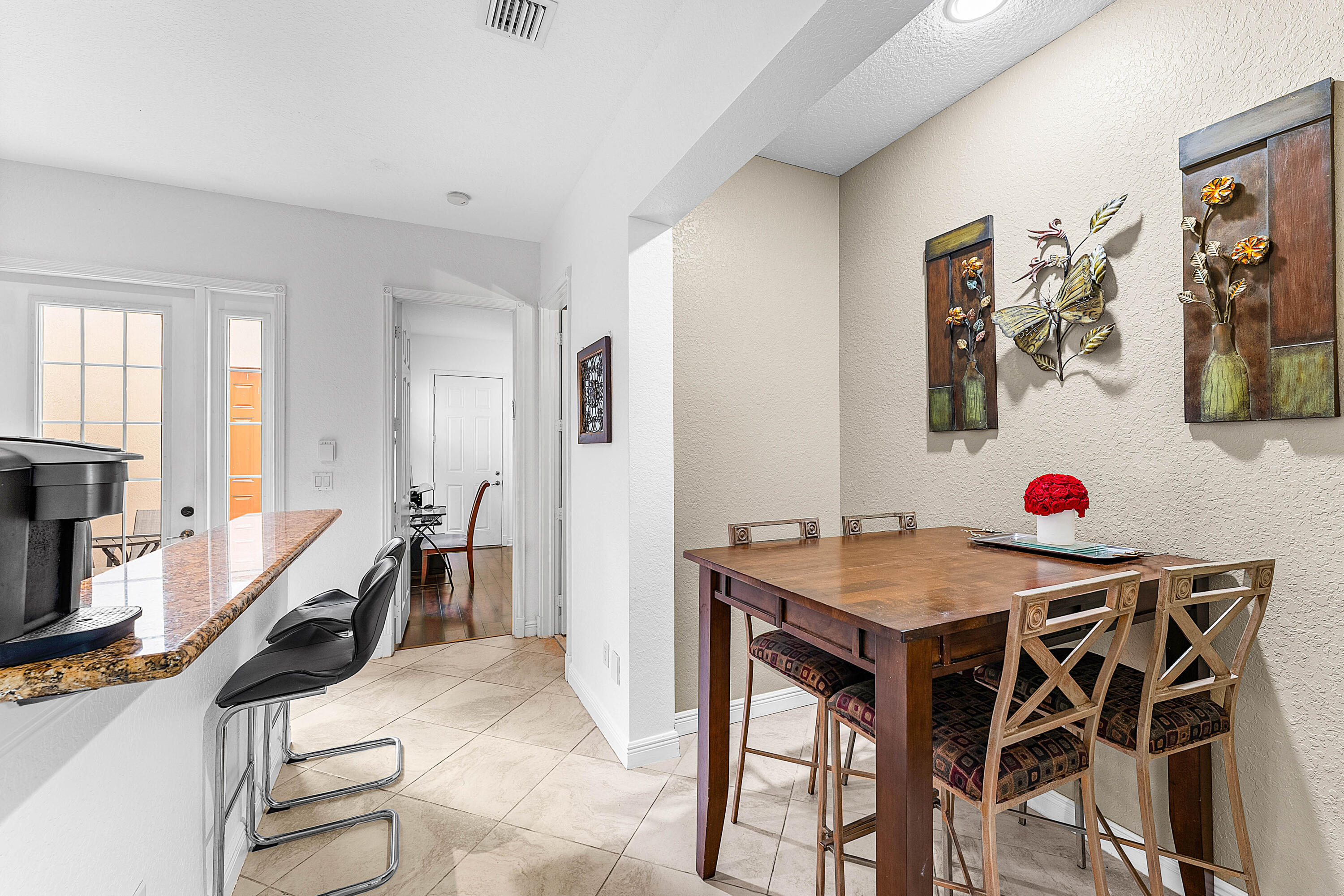 8309 Northwest 8th Way Boca Raton, FL 33487 - Photo 8 of 39 a very nice looking dining room with a table and chairs