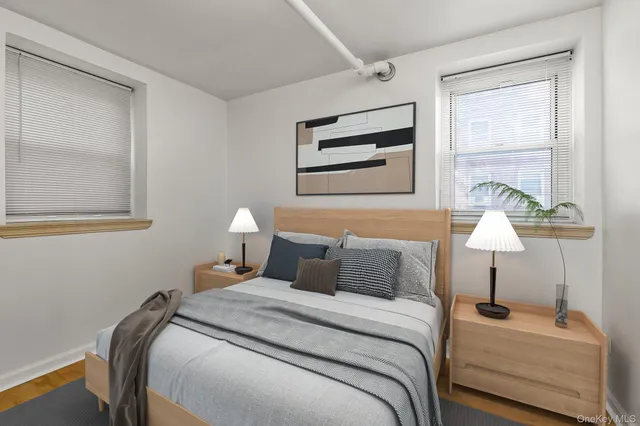 a bedroom with bed and a window