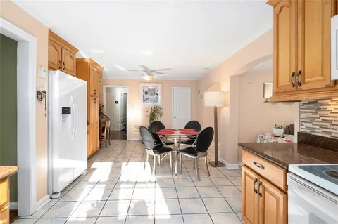 a kitchen with a dining table and chairs