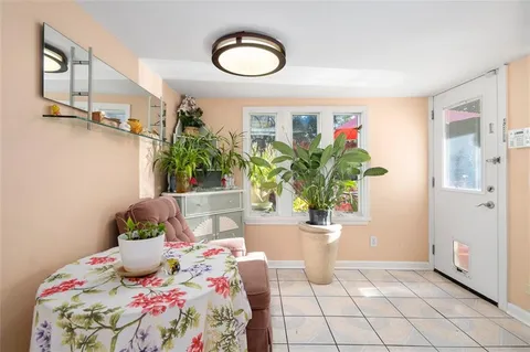 a bath room with a potted plant