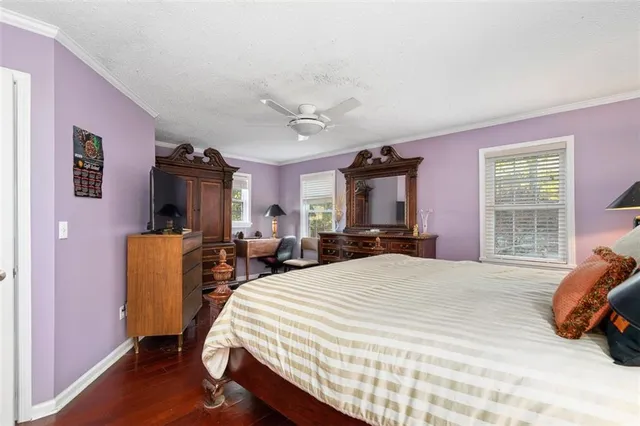 a bed room with a bed and a window