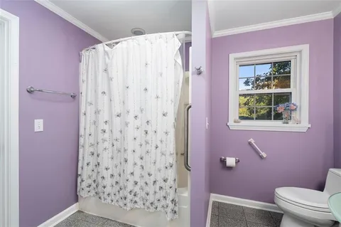 a bathroom with a shower curtain