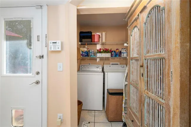 a kitchen with cabinets and a refrigerator
