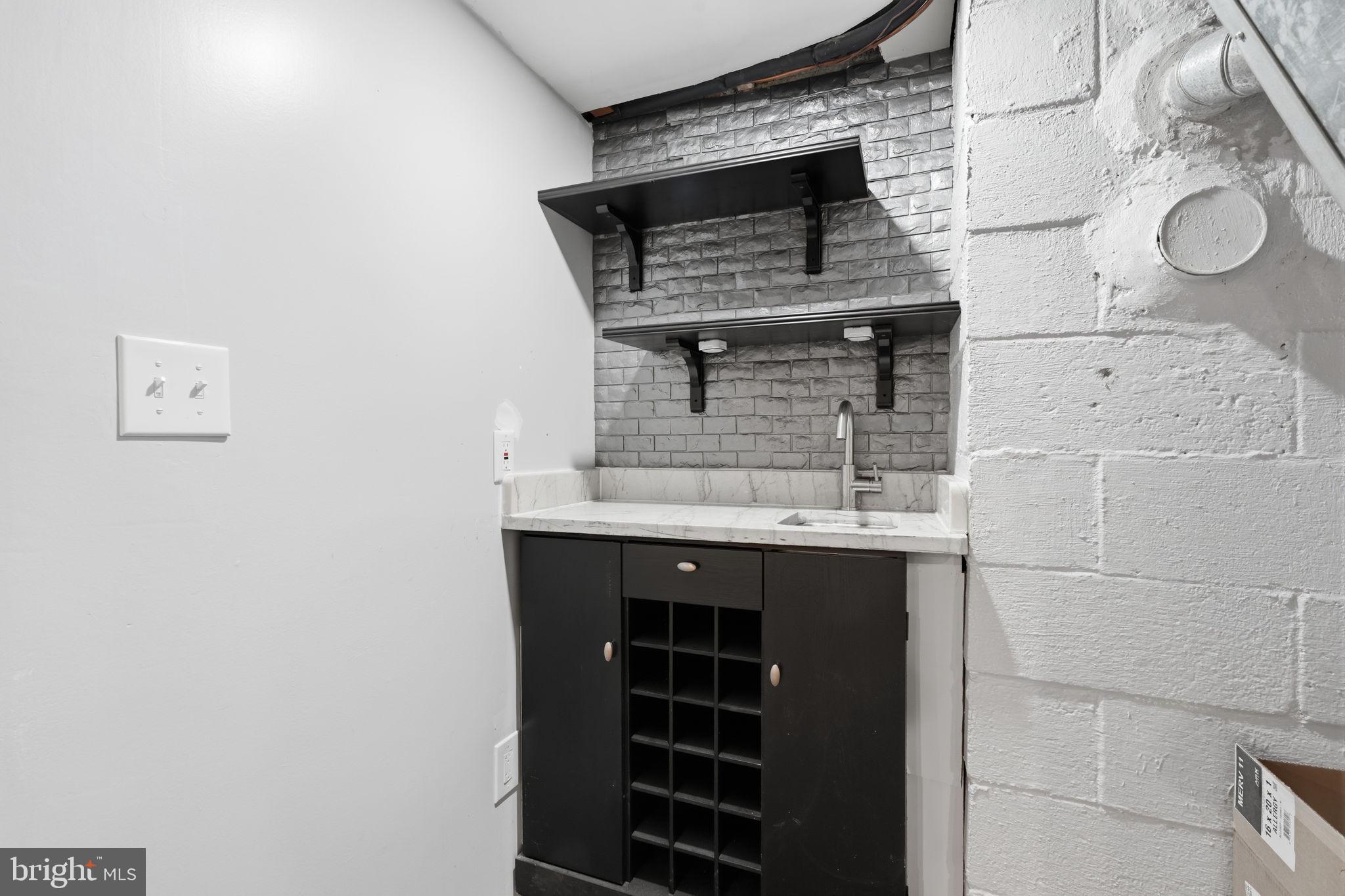 1219 Woodside Road Conshohocken, PA 19428 - Photo 17 of 27 Stylish wet bar with modern accents.